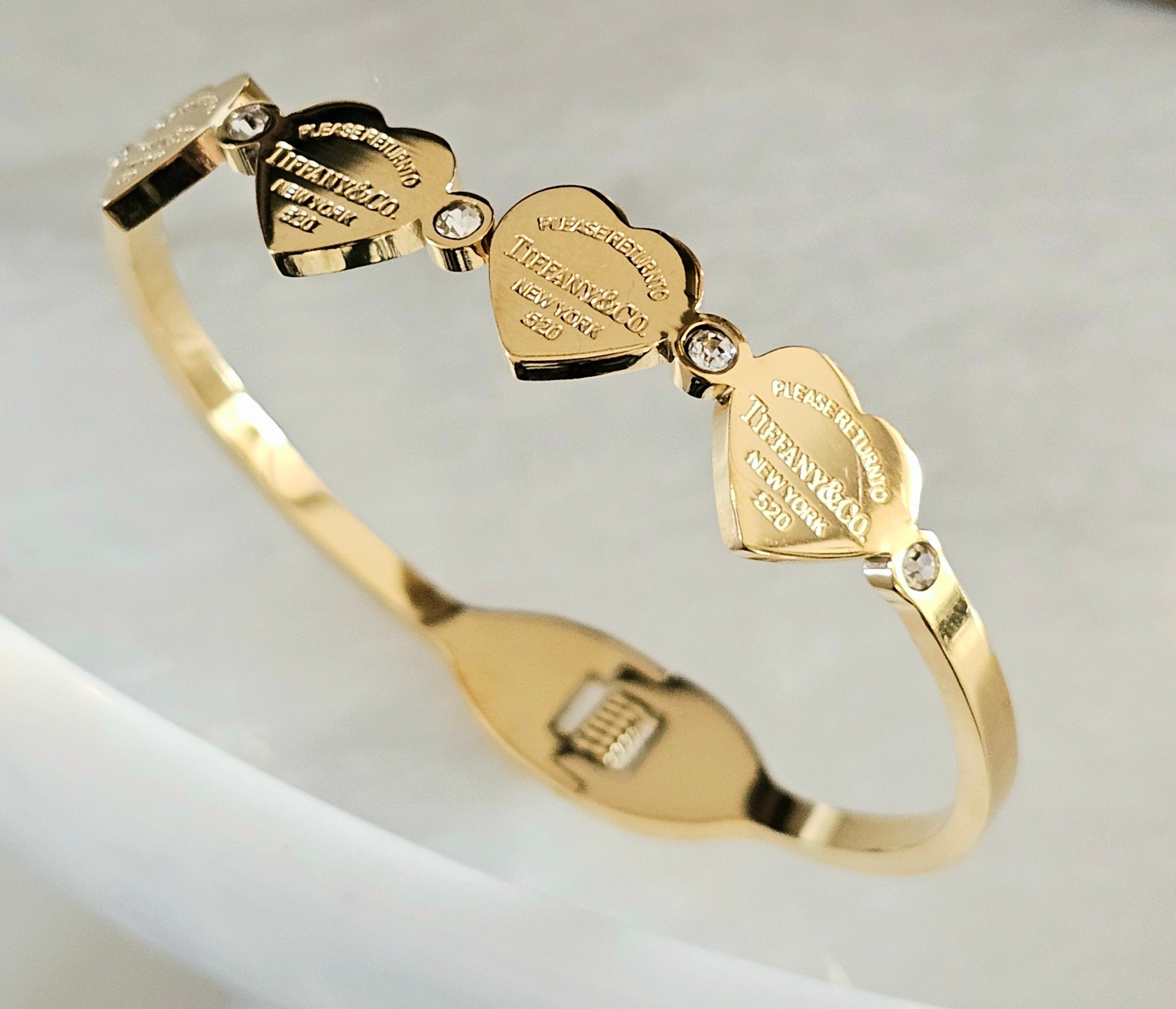 Tiffany 4 hearts gold bangle