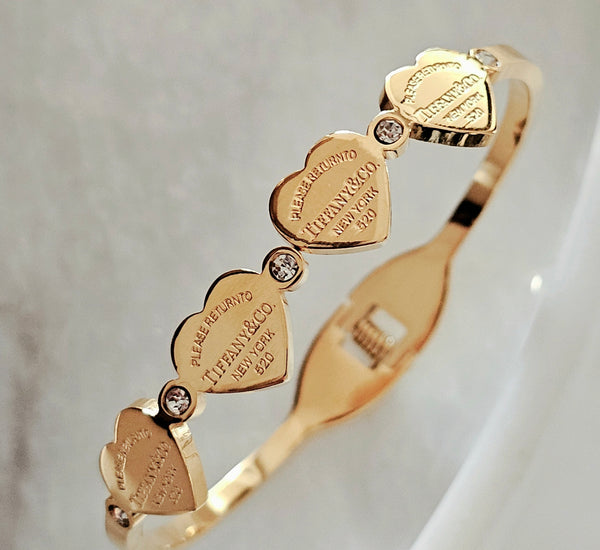 Tiffany 4 hearts gold bangle